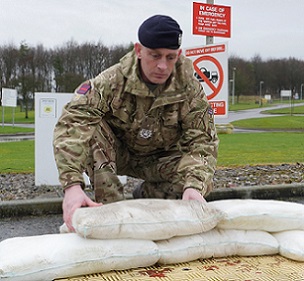 Soldier deploying a FloodSax. The army is sometimes called in if  severe flooding is forecast.
