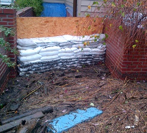 A wall of FloodSax protecting homes from a storm surge during a hurricane in the US