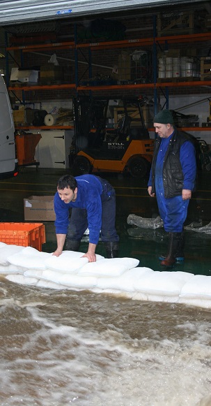 A wall of FloodSax alternative sandbags can keep torrential floodwater out of businesses and here it saved hundreds of thousands of pounds damage at a Yorkshire company