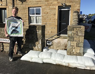 Lewyn Clegg with a pack of 5 FloodSax and around 30 of them have now been deployed to protect his home from flooding