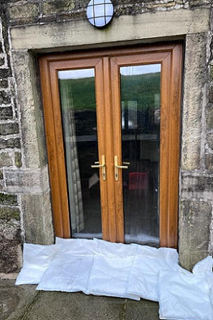 FloodSax sandless sandbags stopping water seeping into John's home in Slaithwaite near Huddersfield