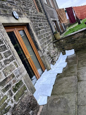 The FloodSax alternative sandbags preventing water getting through the stone