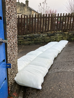 The double line of FloodSax is complete and the house is protected from flooding