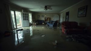 Lounge wrecked by filthy floodwater